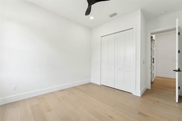3817 W San Nicholas St, Tampa, FL 33629 - unfurnished bedroom with light wood-style flooring, a closet, recessed lighting, and ceiling fan