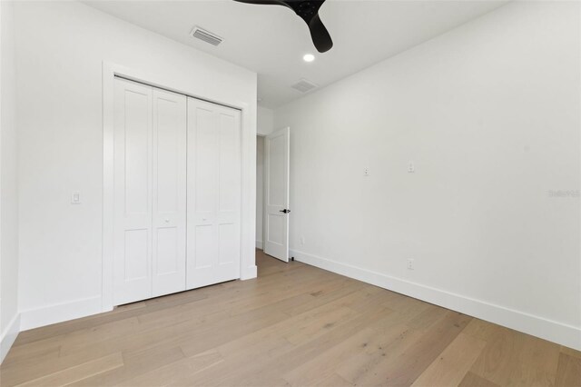 3817 W San Nicholas St, Tampa, FL 33629 - unfurnished bedroom with light wood finished floors, a closet, recessed lighting, and a ceiling fan