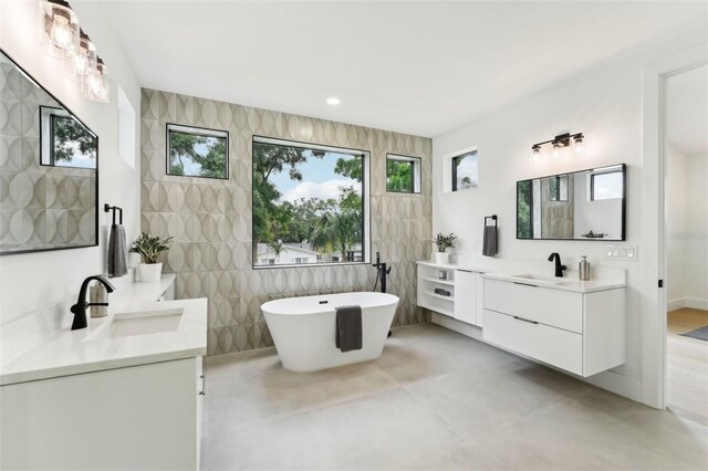 3817 W San Nicholas St, Tampa, FL 33629 - full bath with two vanities, a freestanding bath, and recessed lighting