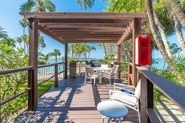 80 Rogers St Unit 6D, Clearwater, FL 33756 - wooden terrace featuring outdoor dining space and a water view