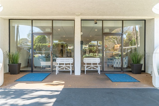 80 Rogers St Unit 6D, Clearwater, FL 33756 - doorway to property with stucco siding