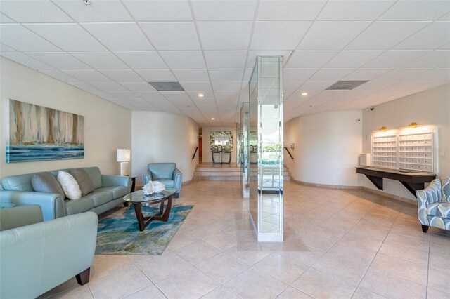 80 Rogers St Unit 6D, Clearwater, FL 33756 - living area with recessed lighting, light tile patterned flooring, a drop ceiling, and baseboards