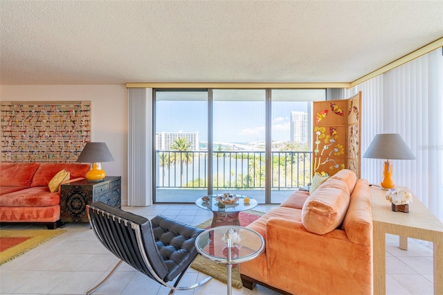 80 Rogers St Unit 6D, Clearwater, FL 33756 - living room with light tile patterned floors, a textured ceiling, and floor to ceiling windows