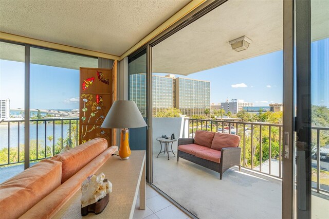 80 Rogers St Unit 6D, Clearwater, FL 33756 - balcony with a water view, an outdoor living space, and a view of city