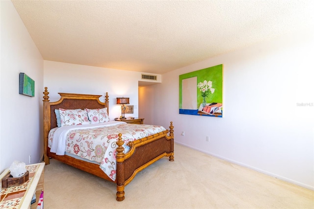 80 Rogers St Unit 6D, Clearwater, FL 33756 - carpeted bedroom with a textured ceiling and baseboards