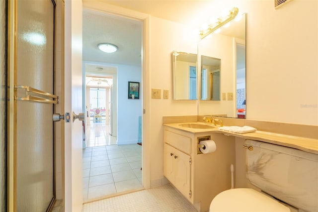 80 Rogers St Unit 6D, Clearwater, FL 33756 - bathroom featuring tile patterned flooring, vanity, toilet, and baseboards