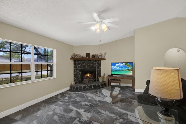 8737 Beaver Ln, Port Richey, FL 34668 - living room featuring baseboards, a fireplace, ceiling fan, and marble finish flooring