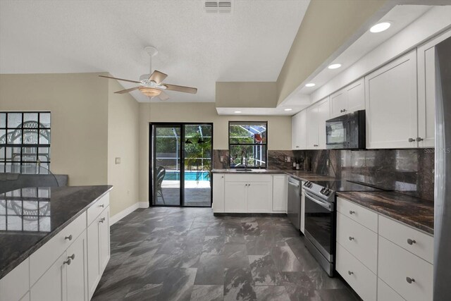 8737 Beaver Ln, Port Richey, FL 34668 - kitchen with appliances with stainless steel finishes, vaulted ceiling, backsplash, baseboards, and a ceiling fan