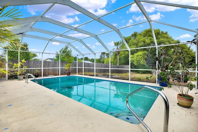 8737 Beaver Ln, Port Richey, FL 34668 - view of swimming pool with a patio area, a fenced backyard, and glass enclosure