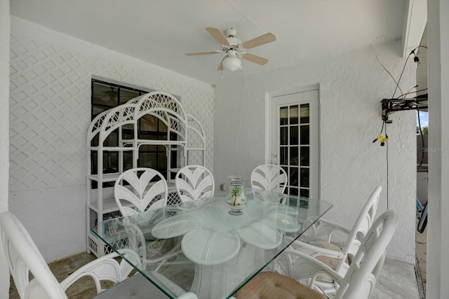 8737 Beaver Ln, Port Richey, FL 34668 - dining room with a textured wall and a ceiling fan