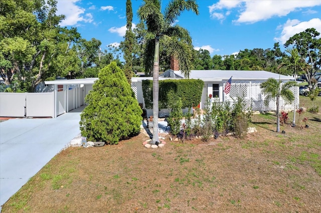 3501 63rd St N, Saint Petersburg, FL 33710 - view of front of home featuring driveway, fence, and an attached carport
