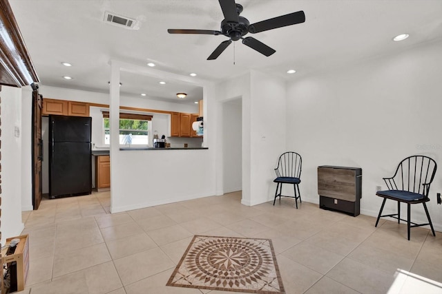 3501 63rd St N, Saint Petersburg, FL 33710 - kitchen featuring freestanding refrigerator, recessed lighting, dark countertops, a ceiling fan, and brown cabinets