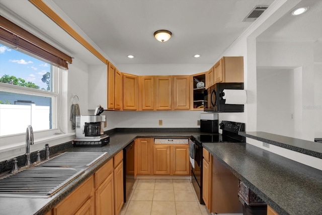 3501 63rd St N, Saint Petersburg, FL 33710 - kitchen with black appliances, a sink, light tile patterned floors, dark countertops, and recessed lighting