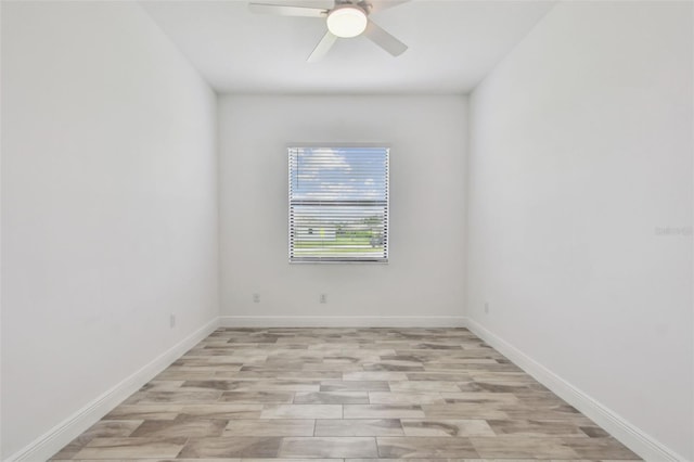 12710 Wheatgrass Ct, Parrish, FL 34219 - spare room with light wood-style floors, a ceiling fan, and baseboards