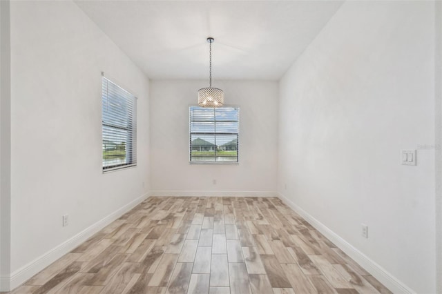 12710 Wheatgrass Ct, Parrish, FL 34219 - unfurnished room with light wood-style flooring and baseboards