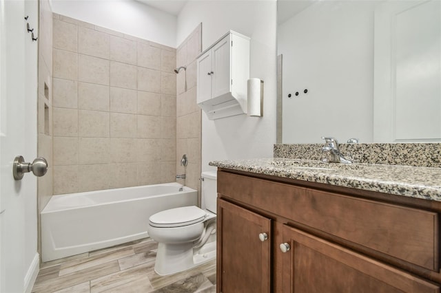 12710 Wheatgrass Ct, Parrish, FL 34219 - bathroom featuring toilet, bathing tub / shower combination, vanity, and wood finished floors