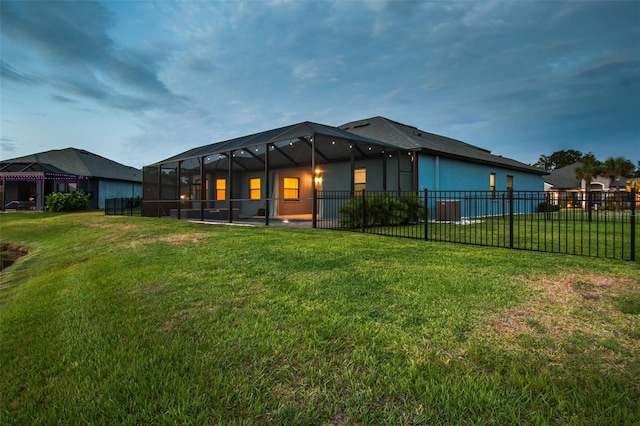 12710 Wheatgrass Ct, Parrish, FL 34219 - rear view of property with glass enclosure and central air condition unit