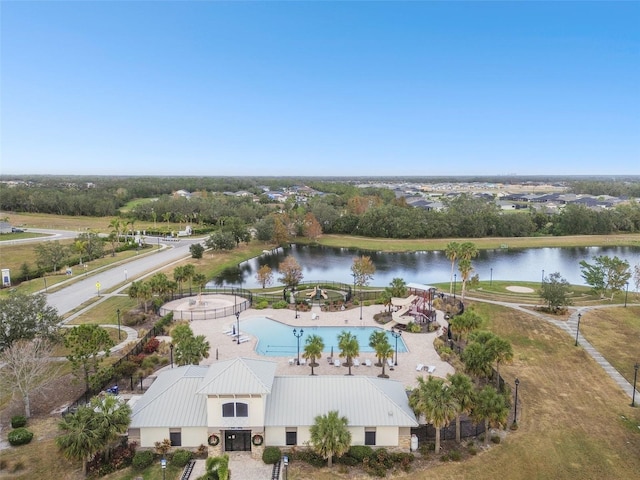 12710 Wheatgrass Ct, Parrish, FL 34219 - aerial view of a large body of water, a pool, and a tree filled landscape