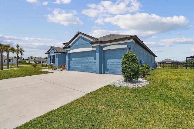 12710 Wheatgrass Ct, Parrish, FL 34219 - view of side of home featuring stucco siding, an attached garage, and concrete driveway