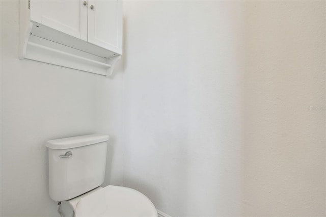 12710 Wheatgrass Ct, Parrish, FL 34219 - bathroom featuring toilet and baseboards