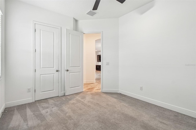 12710 Wheatgrass Ct, Parrish, FL 34219 - unfurnished bedroom featuring carpet, baseboards, and ceiling fan