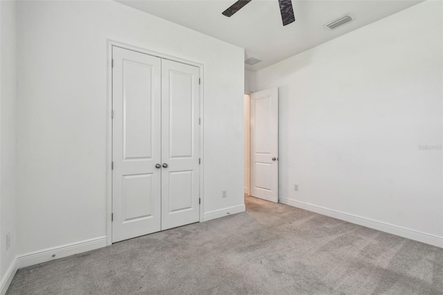 12710 Wheatgrass Ct, Parrish, FL 34219 - unfurnished bedroom featuring carpet, a closet, baseboards, and a ceiling fan