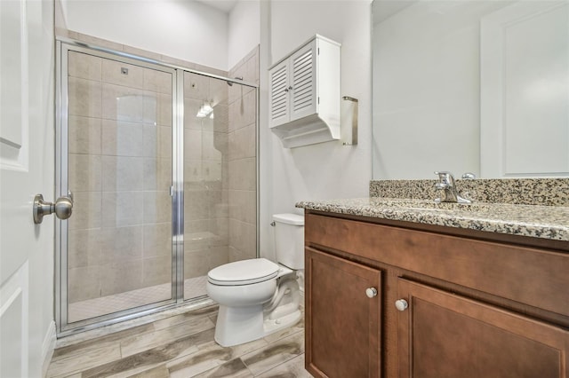 12710 Wheatgrass Ct, Parrish, FL 34219 - bathroom with a shower stall, toilet, and vanity