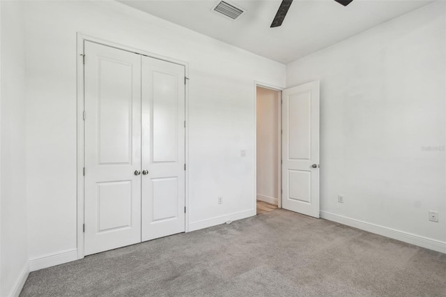 12710 Wheatgrass Ct, Parrish, FL 34219 - unfurnished bedroom featuring carpet floors, baseboards, a closet, and a ceiling fan