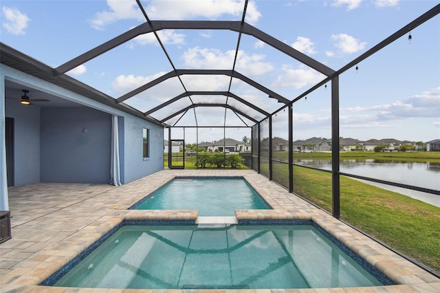 12710 Wheatgrass Ct, Parrish, FL 34219 - view of swimming pool with a water view, a lawn, a patio, a pool with connected hot tub, and a residential view