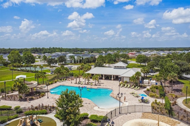 12710 Wheatgrass Ct, Parrish, FL 34219 - community pool with fence, a patio, and a residential view