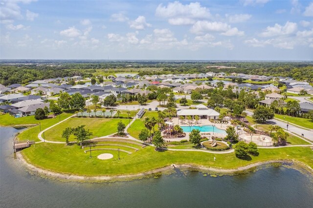 12710 Wheatgrass Ct, Parrish, FL 34219 - aerial perspective of suburban area with a pool area and a nearby body of water