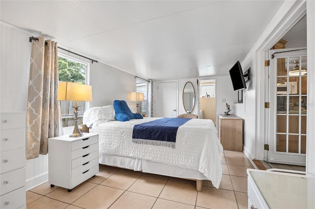 bedroom featuring light tile patterned flooring
