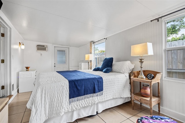 tiled bedroom featuring a wall mounted AC