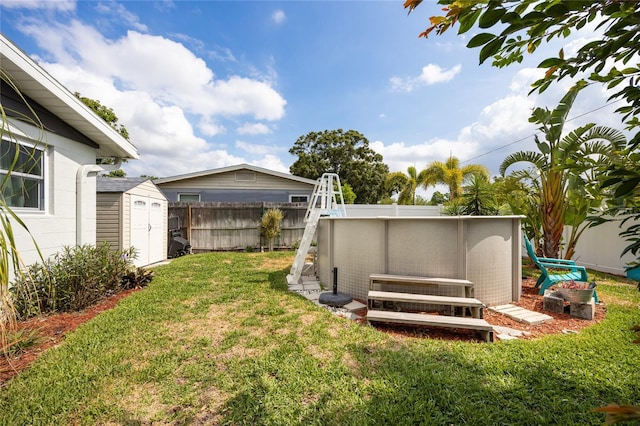view of yard featuring a storage shed and an outbuilding