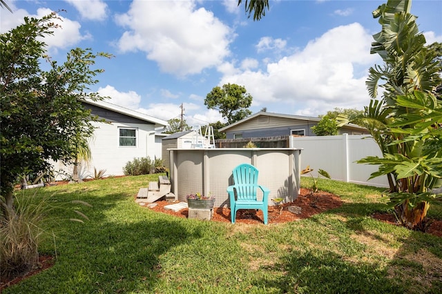 rear view of house featuring an outdoor pool