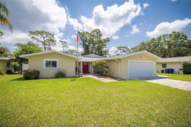 1891 Harmony Dr, Clearwater, FL 33756 - single story home featuring stucco siding, an attached garage, driveway, and a front lawn