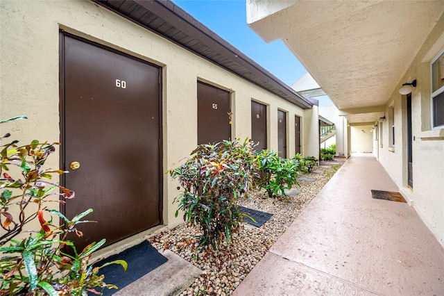 1100 E Bay Dr Unit 60, Largo, FL 33770 - view of exterior entry with stucco siding