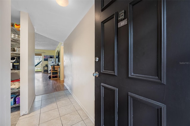 1100 E Bay Dr Unit 60, Largo, FL 33770 - foyer entrance with light tile patterned floors and baseboards