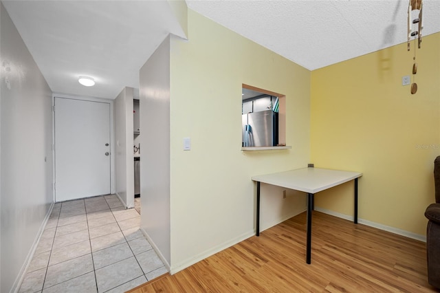 1100 E Bay Dr Unit 60, Largo, FL 33770 - hall with light wood-style floors and baseboards