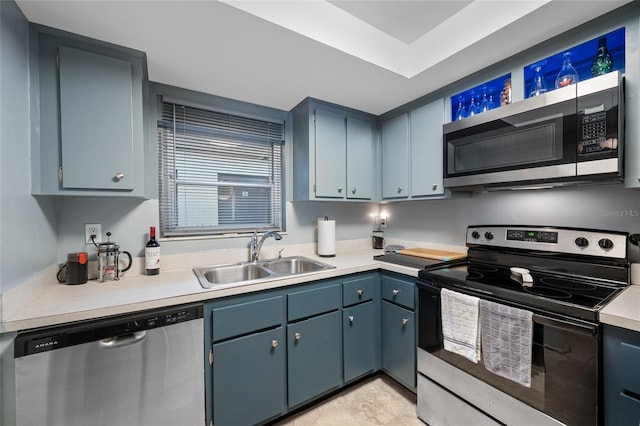 1100 E Bay Dr Unit 60, Largo, FL 33770 - kitchen featuring appliances with stainless steel finishes, a sink, light countertops, and plenty of natural light