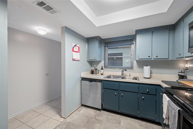 1100 E Bay Dr Unit 60, Largo, FL 33770 - kitchen featuring dishwasher, a sink, light countertops, black electric range, and baseboards