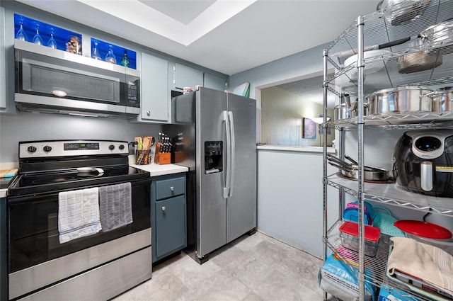 1100 E Bay Dr Unit 60, Largo, FL 33770 - kitchen with appliances with stainless steel finishes and light countertops