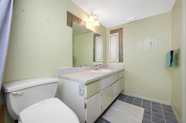 1100 E Bay Dr Unit 60, Largo, FL 33770 - bathroom with tile patterned floors, toilet, vanity, and baseboards
