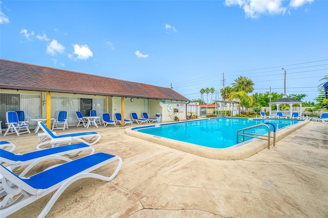 1100 E Bay Dr Unit 60, Largo, FL 33770 - community pool with a patio, a gazebo, and fence