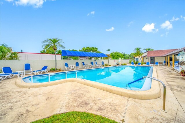 1100 E Bay Dr Unit 60, Largo, FL 33770 - community pool featuring a patio and fence
