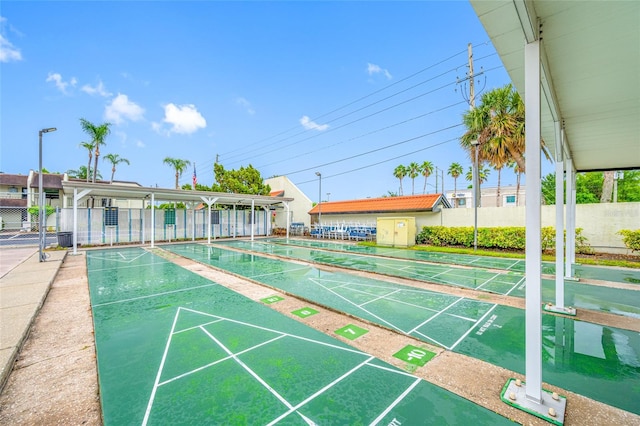 1100 E Bay Dr Unit 60, Largo, FL 33770 - view of property's community featuring fence and shuffleboard