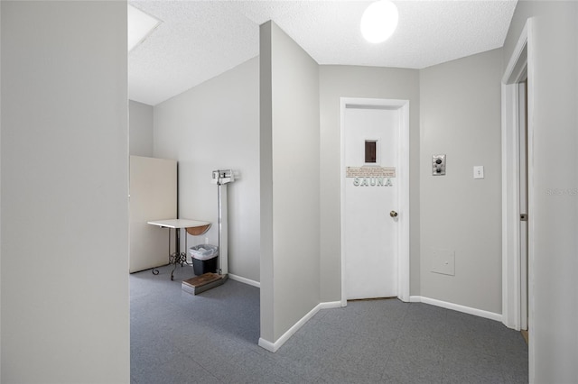 1100 E Bay Dr Unit 60, Largo, FL 33770 - hallway with baseboards, tile patterned floors, and a textured ceiling