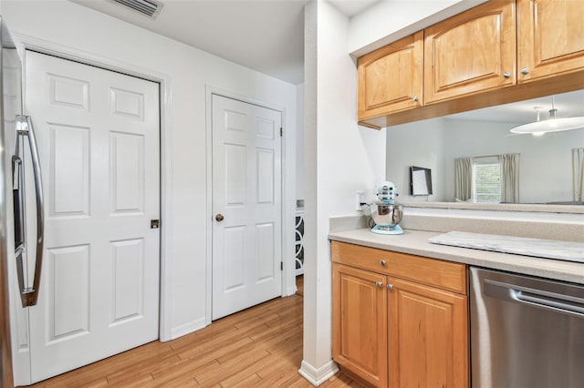 3205 W De Leon St Unit F, Tampa, FL 33609 - bar area with stainless steel appliances and light wood-type flooring
