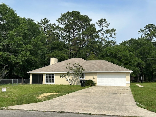 607 NE 10th Blvd, Williston, FL 32696 - view of front of property featuring concrete driveway, a garage, a chimney, and stucco siding