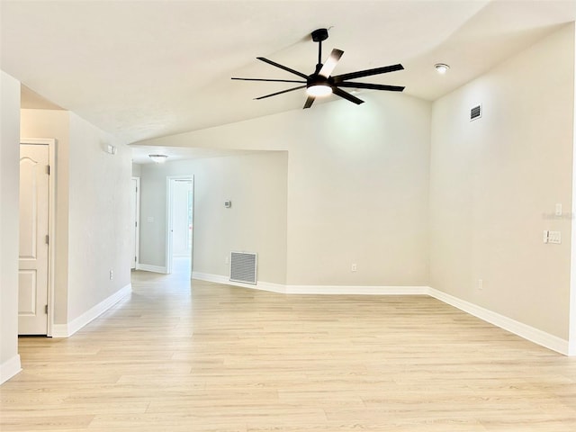 607 NE 10th Blvd, Williston, FL 32696 - empty room featuring vaulted ceiling, ceiling fan, light wood-style floors, and baseboards